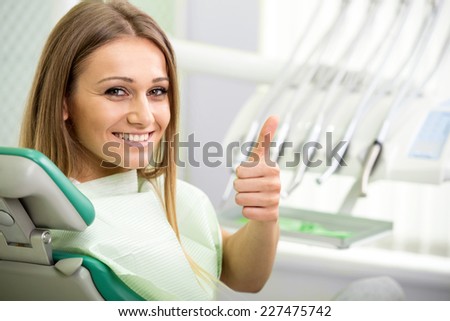 Portrait of woman patient at the dentist waiting to be checked up.