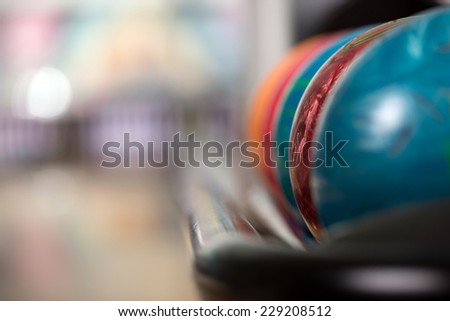 Close-up a group of colored bowling balls in the club.