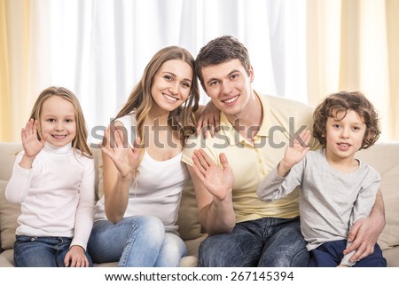 Happy to be a family. Portrait of happy family with kids on the couch.