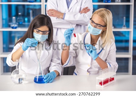 Laboratory, chemistry and science concept. Science team working in a laboratory.
