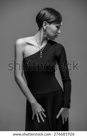 Portrait of an elegant young  asian woman in black evening dress. Black and white fashion shot.