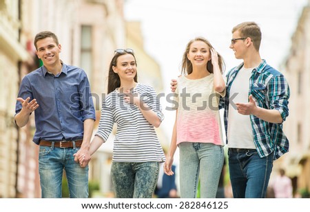 Double couple date. Friends walking down the street together.