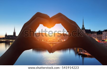 heart shape hand  in Stockholm city at night