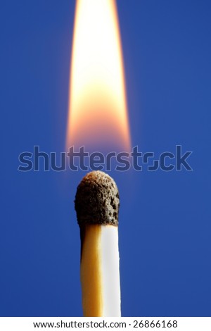High resolution photo of burning Match with blue background