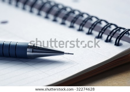 Close up of a pen on a note pad