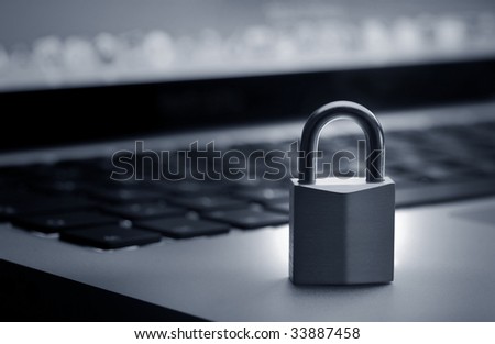 Lock on laptop keyboard with shallow depth of field