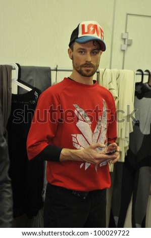  - stock-photo-moscow-march-a-dresser-gets-model-ready-backstage-at-the-dima-neu-for-fall-winter-100029722