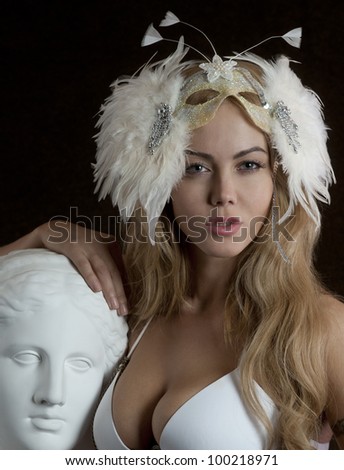 Beauty contest winner posing sexy with venera statue