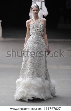 PARIS, FRANCE - MARCH 08: A model walks runway during the Alexander McQueen Ready to Wear Autumn/Winter 2011/2012 show during Paris Fashion Week at La Conciergerie on March 8, 2011 in Paris, France.