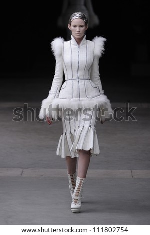 PARIS, FRANCE - MARCH 08: A model walks the runway during Alexander McQueen Ready to Wear Autumn/Winter 2011/2012 show during Paris Fashion Week at La Conciergerie on March 8, 2011 in Paris, France.
