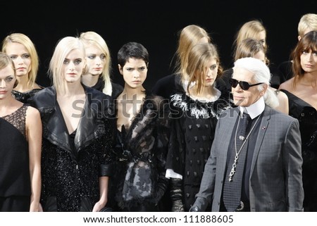 PARIS FRANCE MARCH 08 Karl Lagerfield and models walks the runway during the Chanel Autumn Winter 2011 2012 show during Paris Fashion Week at Grand Palais on March 8 2011 in Paris France PARIS FRANCE MARCH 08 Karl Lagerfield and models walks the runway during the Chanel Autumn Winter 2011 2012 show during Paris Fashion Week at Grand Palais on March 8 2011 in Paris France