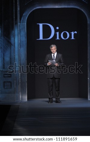 PARIS, FRANCE - MARCH 04: An announcement before runway during the Christian Dior Ready to Wear Autumn/Winter 2011/2012 show during Paris Fashion Week at Musee Rodin on March 4, 2011 in Paris, France.