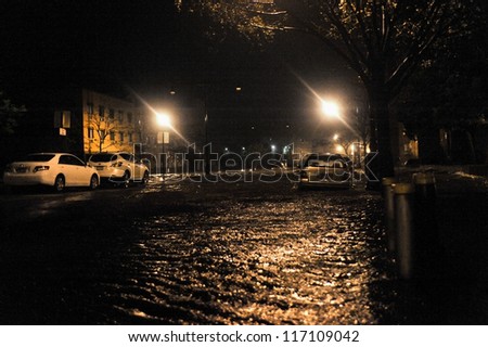 BROOKLYN, NY - OCTOBER 29: Flooded streets, caused by Hurricane Sandy, are seen on October 29, 2012, in the corner of Brigham street and  Emmons Avenue of Brooklyn NY, United States.