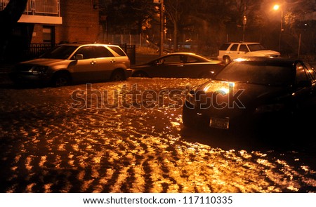 BROOKLYN, NY - OCTOBER 29: Flooded streets, caused by Hurricane Sandy, are seen on October 29, 2012, in the corner of Bragg street and  Shore Pway of Brooklyn NY, United States.