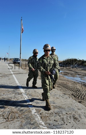 NEW YORK, NY - NOVEMBER 09: U.S. Marines from the 8th Engineer Support Battalion out of NC, move a debris and parts of destroyed houses in the Breezy Point on November 9, 2012 in the Queens of NY.