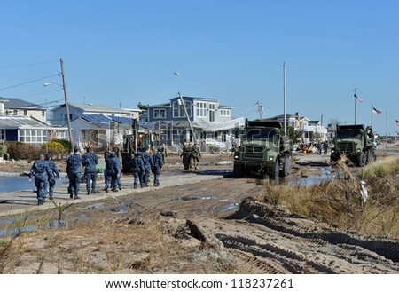 NEW YORK, NY - NOVEMBER 09: U.S. Marines from the 8th Engineer Support Battalion out of NC, move a debris and parts of destroyed houses in the Breezy Point on November 9, 2012 in the Queens of NY.
