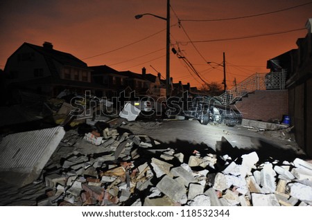QUEENS, NY - NOVEMBER 11: Damaged houses without power at night in the Rockaway due to impact from Hurricane Sandy in Queens, New York, U.S., on November 11, 2012.