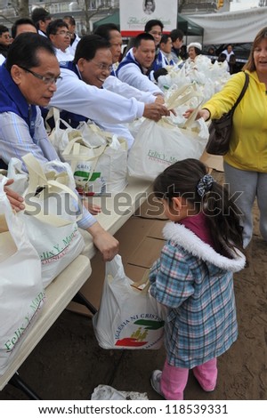 QUEENS, NY - NOVEMBER 11: People getting help with hot food, clothes and supplies in the Rockaway due to impact from Hurricane Sandy in Queens, New York, U.S., on November 11, 2012.