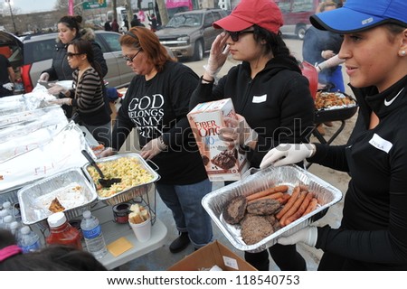 QUEENS, NY - NOVEMBER 11: People getting help with hot food, clothes and supplies in the Rockaway beach area due to impact from Hurricane Sandy in Queens, New York, U.S., on November 11, 2012.