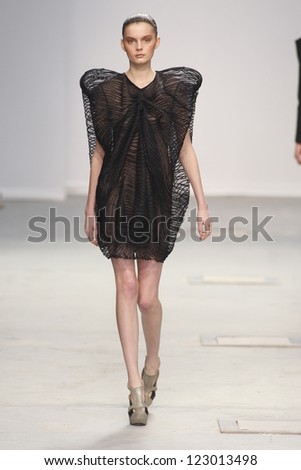 PARIS, FRANCE - MARCH 04: A model walks the runway during the Amaya Arzuaga Ready to Wear Autumn/Winter 2011/2012 show during Paris Fashion Week on March 4, 2011 in Paris, France