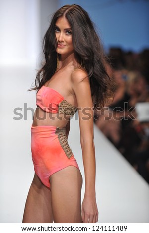 LOS ANGELES - OCTOBER 19: Model walks runway at the Culture Swimwear Fashion Show for SS 2013 at Sunset Gower Studios during Los Angeles Fashion Weekend on October 19, 2012 in Los Ageles, CA