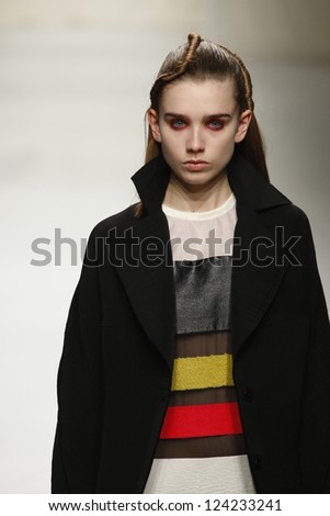 PARIS, FRANCE - MARCH 07: A model walks the runway during the Comuun Ready to Wear Autumn/Winter 2011/2012 show during Paris Fashion Week on March 7, 2011 in Paris, France