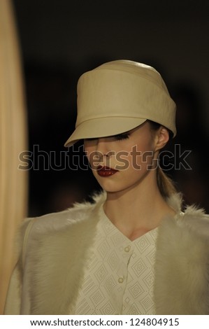 PARIS, FRANCE - MARCH 06: A model walks the runway at the Hermes fashion show during Paris Fashion Week on March 6, 2011 in Paris, France