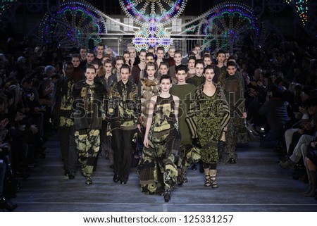 PARIS, FRANCE - MARCH 06: Models walk the runway at the Kenzo fashion show during Paris Fashion Week on March 6, 2011 in Paris, France.