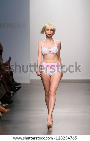 NEW YORK - FEBRUARY 13: Model walks runway for Dos Caras Swimwear collection at Pier 59 studios during Nolcha Fashion Week on February 13, 2013 in New York City