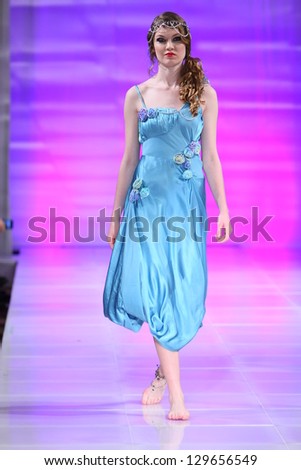 NEW YORK - FEBRUARY 15: A model walks the runway at the Ruby Johns Fall Winter 2013 fashion show during Couture Fashion Week on February 15, 2013 in New York City.