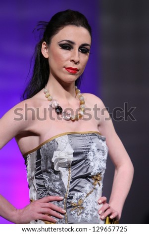 NEW YORK - FEBRUARY 15: A model walks the runway at the Ruby Johns Fall Winter 2013 fashion show during Couture Fashion Week on February 15, 2013 in New York City.