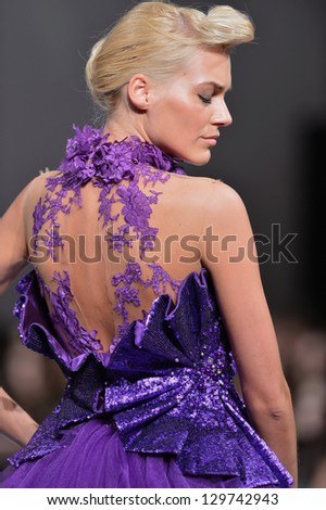 NEW YORK - FEBRUARY 16:  A Model walks on the Kostas Luxury Outerwear fashion runway at The New Yorker Hotel during Couture Fashion Week on February 16, 2013 in New York City