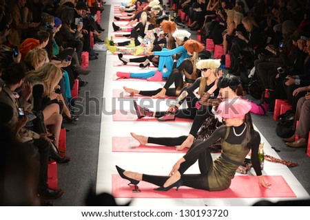NEW YORK, NY - FEBRUARY 11: Model makes fitness workout on the runway at the Betsey Johnson Fall 2013 fashion show during Mercedes-Benz Fashion Week on February 11, 2013 in New York City.