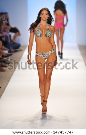 MIAMI - JULY 22: Model walking runway at the Manglar Collection for Spring/ Summer 2014 during Mercedes-Benz Swim Fashion Week on July 22, 2013 in Miami, FL
