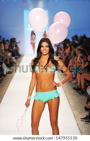 MIAMI BEACH, FL - JULY 22: A model walks the runway at the Lolli Swim show during Mercedes-Benz Fashion Week Swim 2014 at the Raleigh on July 22, 2013 in Miami Beach, Florida.