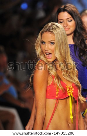 MIAMI, FL - JULY 22: A model walks the runway at the Indah show during Mercedes-Benz Fashion Week Swim 2014 at Cabana Grande at the Raleigh on July 22, 2013 in Miami, Florida.