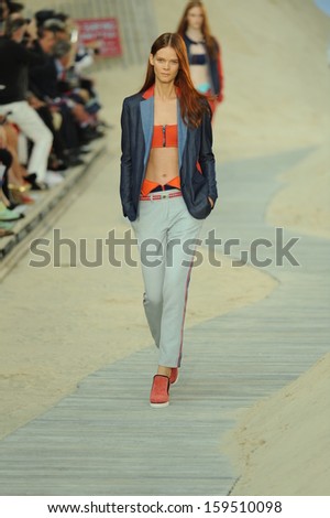 NEW YORK, NY - SEPTEMBER 09: A model walks the runway at the Tommy Hilfiger Women\'s fashion show during Mercedes-Benz Fashion Week on September 9, 2013 in New York City.