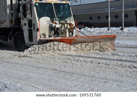 Sanitation tracks cleaning streets in Brooklyn is seen after the seasons first snow storm in NYC