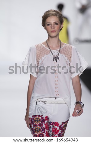 NEW YORK, NY - SEPTEMBER 06: A model walks the runway at the Rebecca Minkoff show during Spring 2014 Mercedes-Benz Fashion Week at The Theatre at Lincoln Center on September 6, 2013 in New York City.