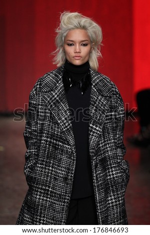 NEW YORK, NY - FEBRUARY 09: A model walks the runway at the DKNY Women\'s fashion show during Mercedes-Benz Fashion Week Fall 2014 on February 9, 2014 in New York City.