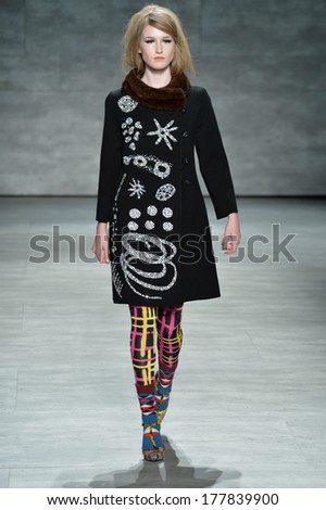 NEW YORK, NY - FEBRUARY 11: A model walks the runway at the Libertine fashion show during Mercedes-Benz Fashion Week Fall 2014 at Lincoln Center on February 11, 2014 in New York City.