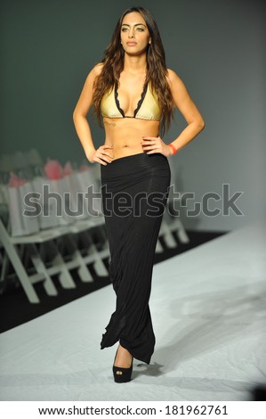 LOS ANGELES, CA - MARCH 11: A model walks the runway at Miss Kinsman Swim rehearsal show during Style Fashion Week Fall 2014 at The Live Event Arena on March 11, 2014 in LA.