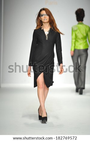 Los Angeles, CA - MARCH 13: A model walks the runway at Quynh Paris fashion show during Style Fashion Week Fall 2014 at The LA Live Event Deck on March 13, 2014 in LA.