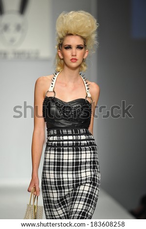 Los Angeles, CA - MARCH 11: A model walks the runway at Mister Triple X show during Style Fashion Week Fall 2014 at The LA Live Event Deck on March 11, 2014 in LA