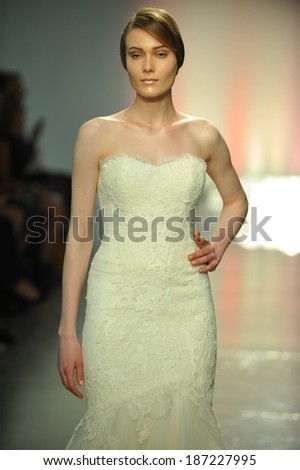 NEW YORK, NY - APRIL 11: A model walks the runway during the RIVINI Spring 2015 Bridal collection show at on April 11, 2014 in New York City.