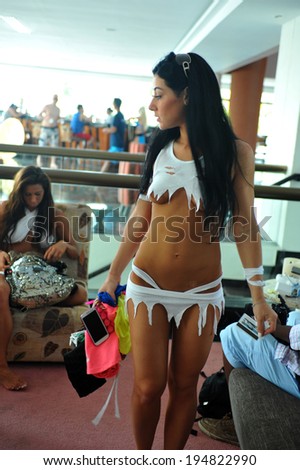 CANCUN, MEXICO - MAY 05: Models getting ready backstage for white t-shirt project during IBMS - International Bikini Model Search 2014 at the Oasis Sens Resort  on May 05, 2014 in Cancun, Mexico.