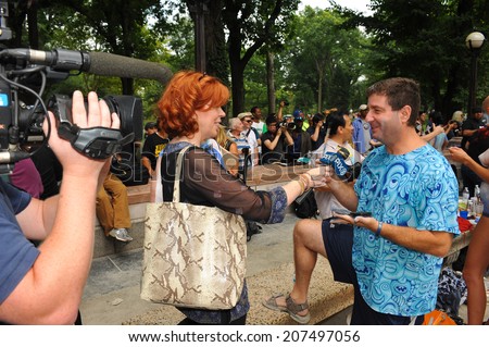 NEW YORK - JULY 26: Artist Andy Golub giving away TV interview during first official Body Painting Event featuring artist Andy Golub on July 26, 2014 in New York NY