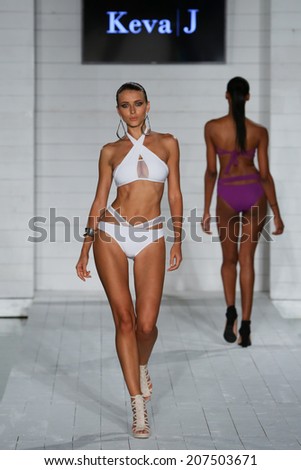 MIAMI - JULY 17: Model walks runway at Keva J. collection at SoHo Beach House during Miami Swim Fashion Week on July 17, 2014 in Miami Beach Florida