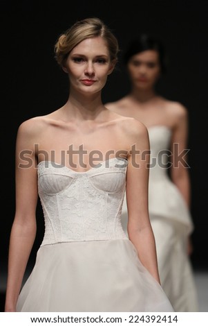 NEW YORK, NY - OCTOBER 12: Models walk the runway finale at the Jenny Lee Fall 2015 Bridal collection show at Pier 94 on October 12, 2014 in New York City.