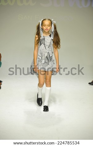 NEW YORK, NY - OCTOBER 18: A model walks the runway during the Alivia Simone preview at petite PARADE Kids Fashion Week at Bathhouse Studios on October 18, 2014 in New York City.
